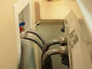 Inspect the washing machine pipes.